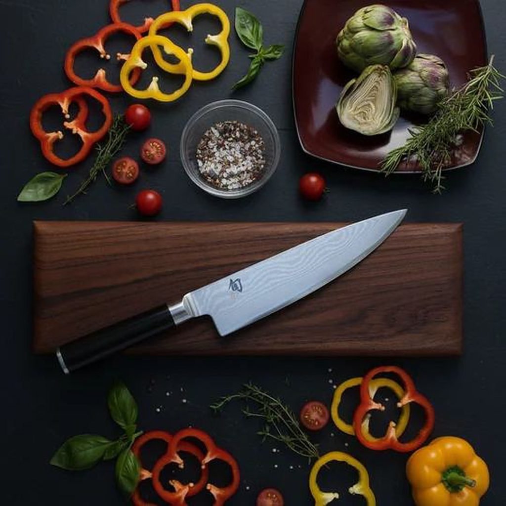 Shun Damascus chef knife with colourful peppers