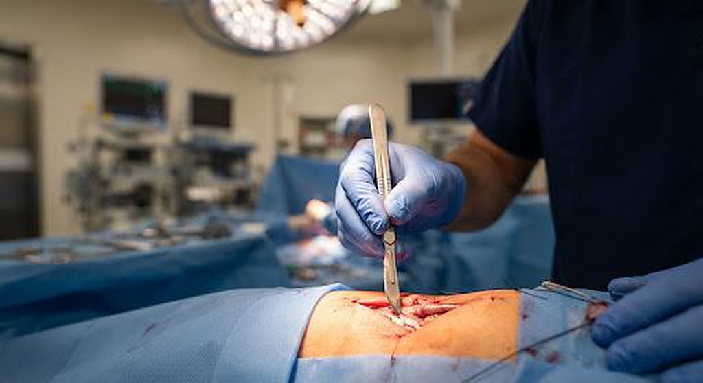 Surgeon holding a KAI surgical scalpel